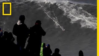 Watch Surfer Ride RecordBreaking Wave  National Geographic [upl. by Ellinet565]